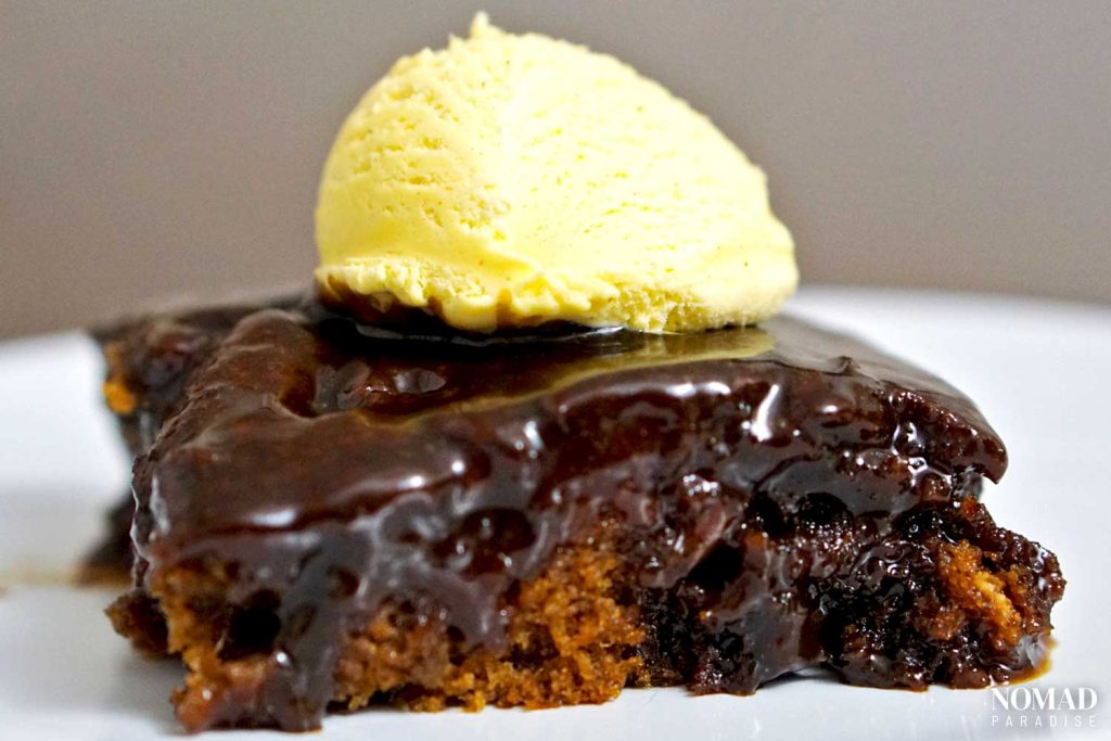 Sticky toffee pudding served with ice cream.