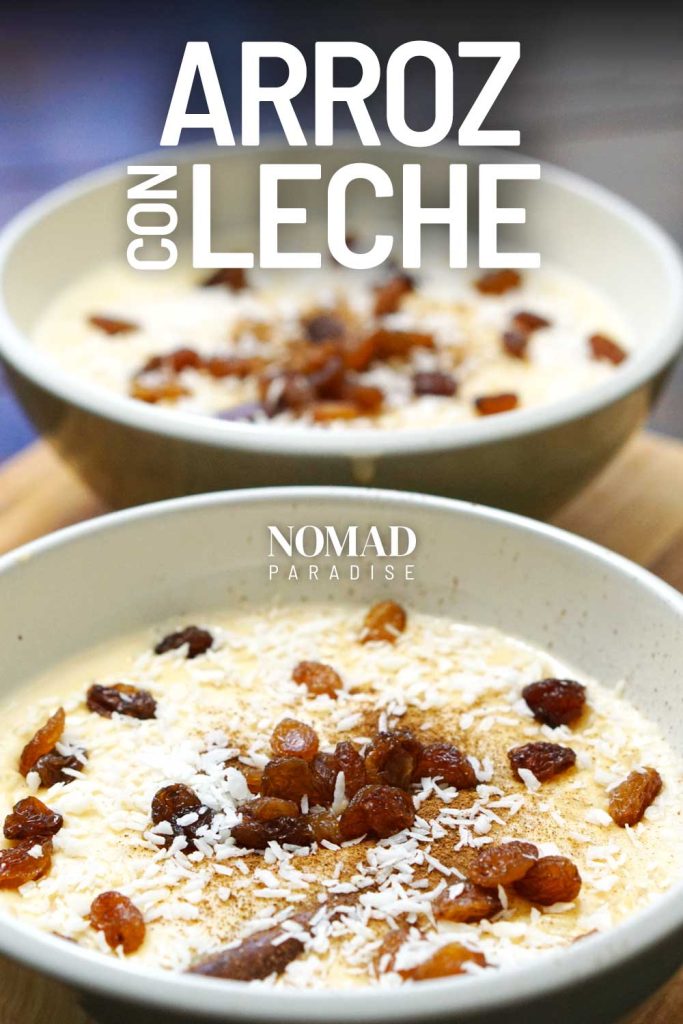 Arroz con leche in bowls with ground cinnamon, shredded coconut, and raisins on top.
