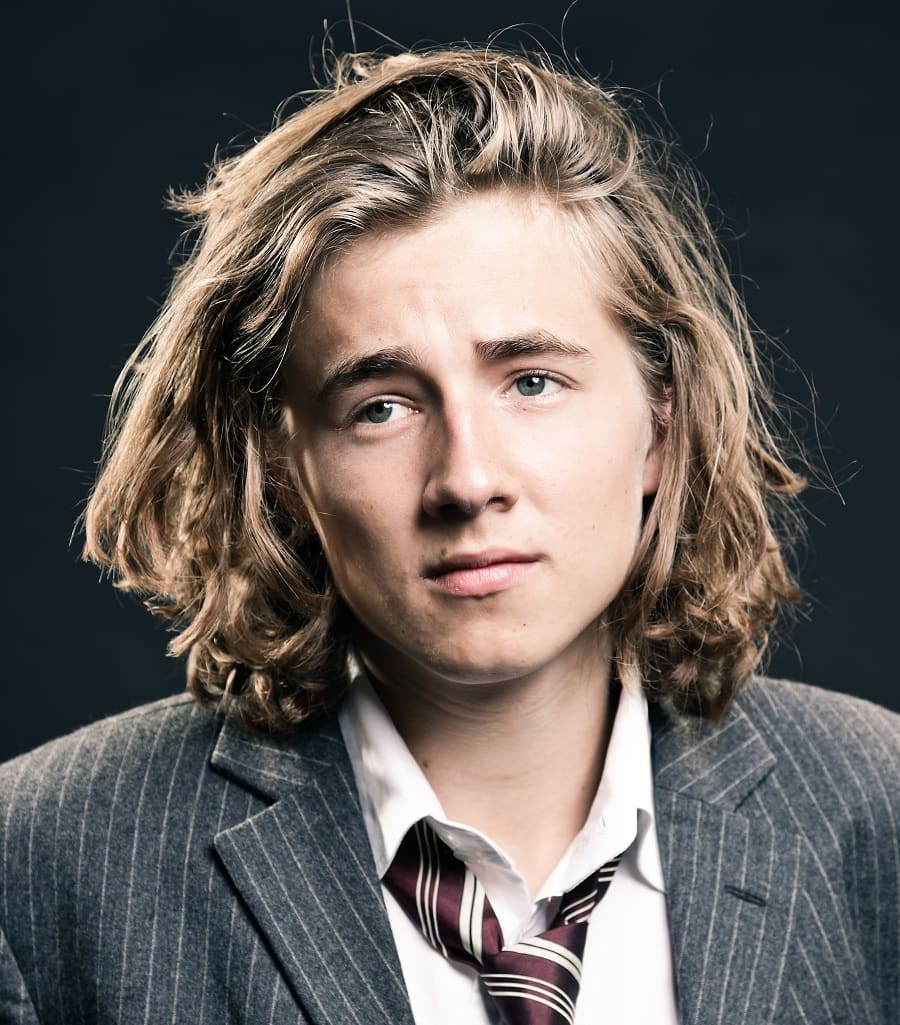 side swept wavy long hairstyle for men