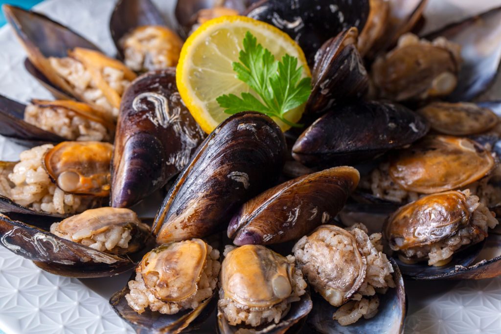 A plate of rice-stuffed mussels.