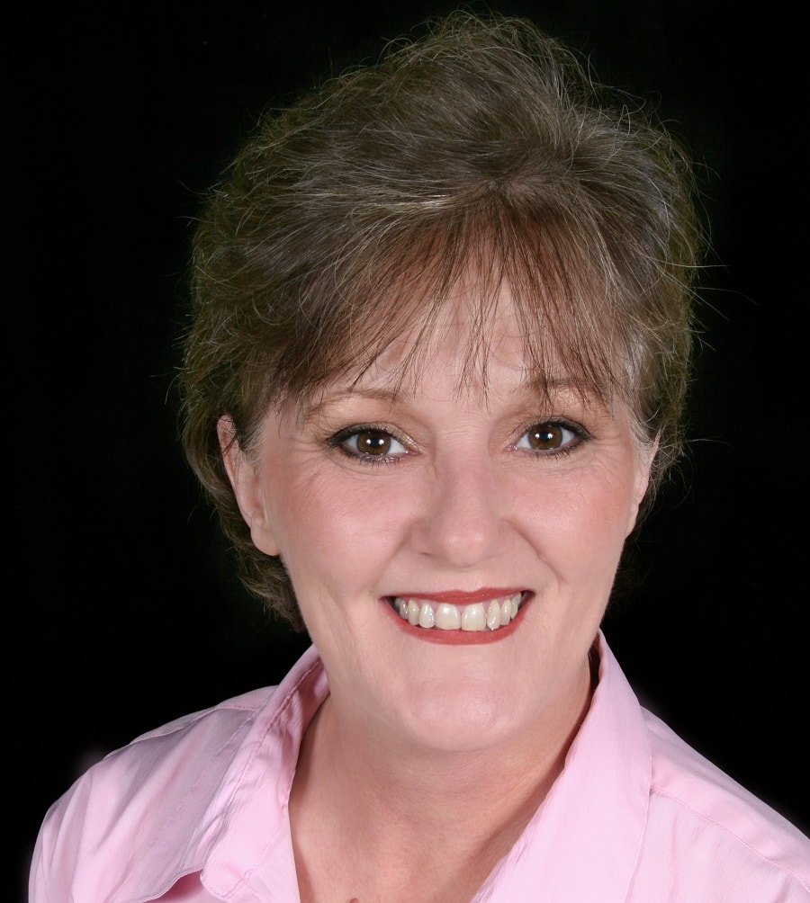 woman over 50 with short brunette hair