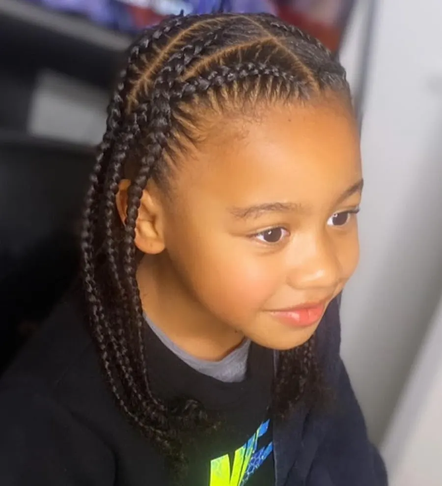 little boy with long braids