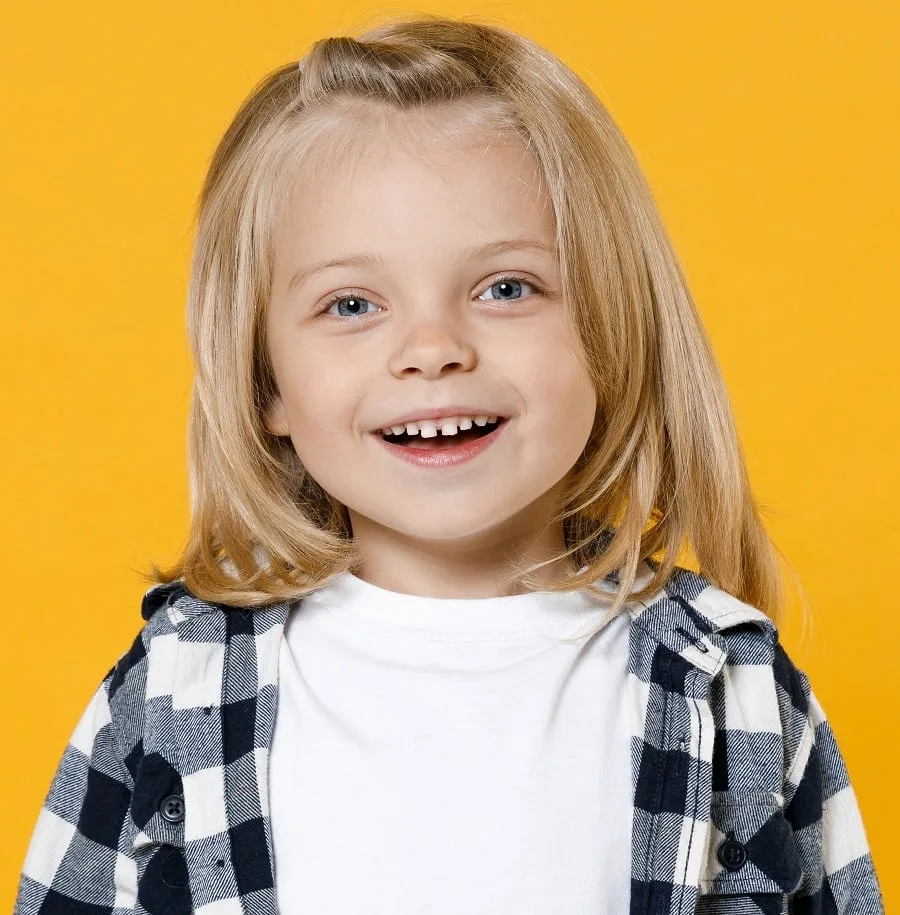 little boy with straight long blonde hair
