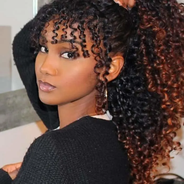 mixed girl with curly bangs and ponytail