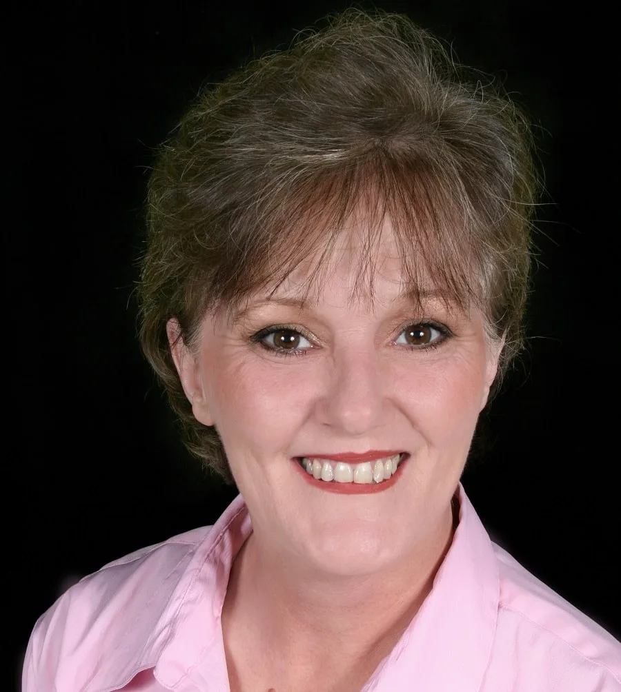 woman over 50 with short brunette hair